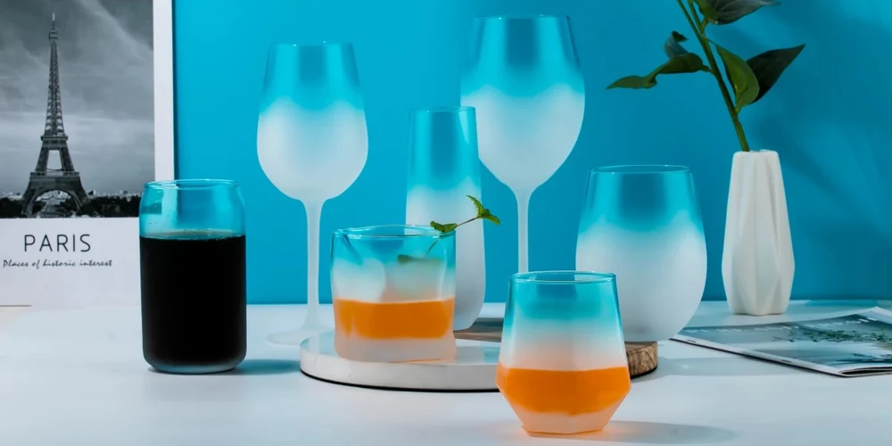 Gradient ocean blue color spraying and frosted ombre finish on complete wine and champagne glassware family