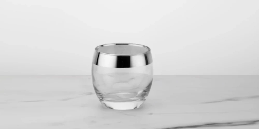 Ion plated titanium silver mirror band on rounded drinking glass rim