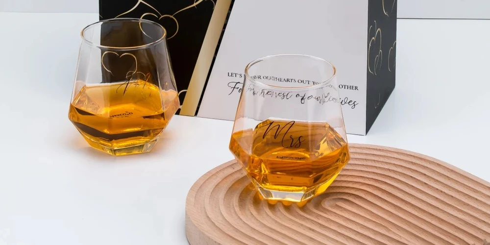 Silk screen printing with metallic gold typography on faceted geometric whiskey tumblers and presentation box