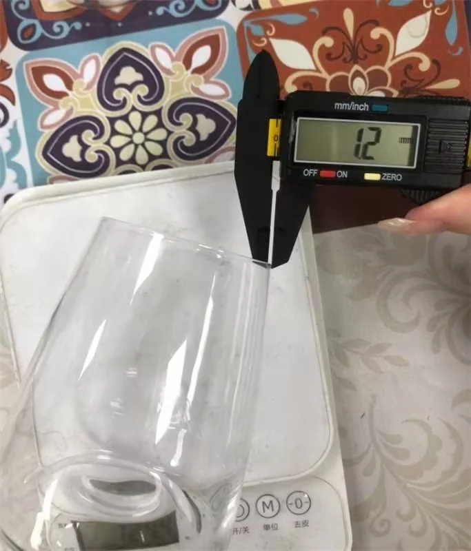 Digital caliper measurement of glassware rim thickness ensuring 1.2mm tolerance and tare weight consistency